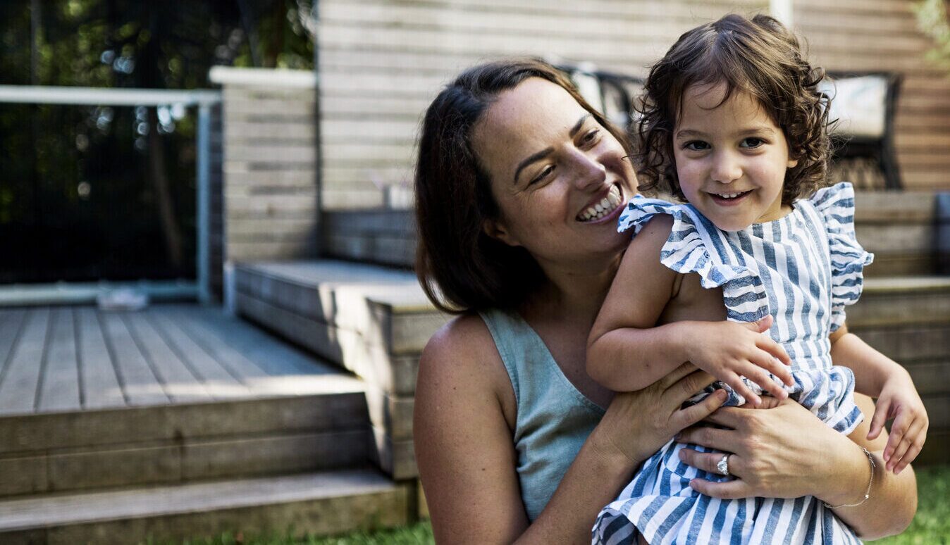 Mother and child playing in garden