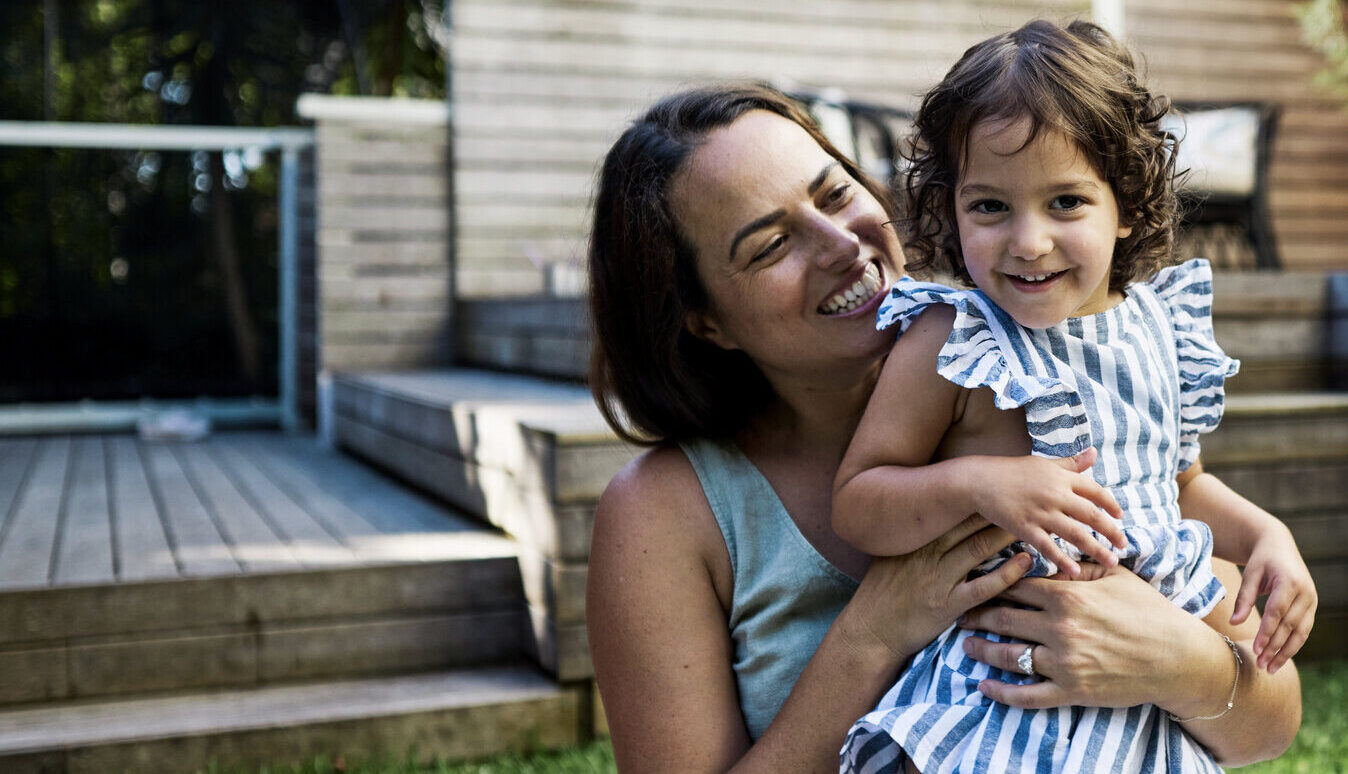 Mother and child playing in garden